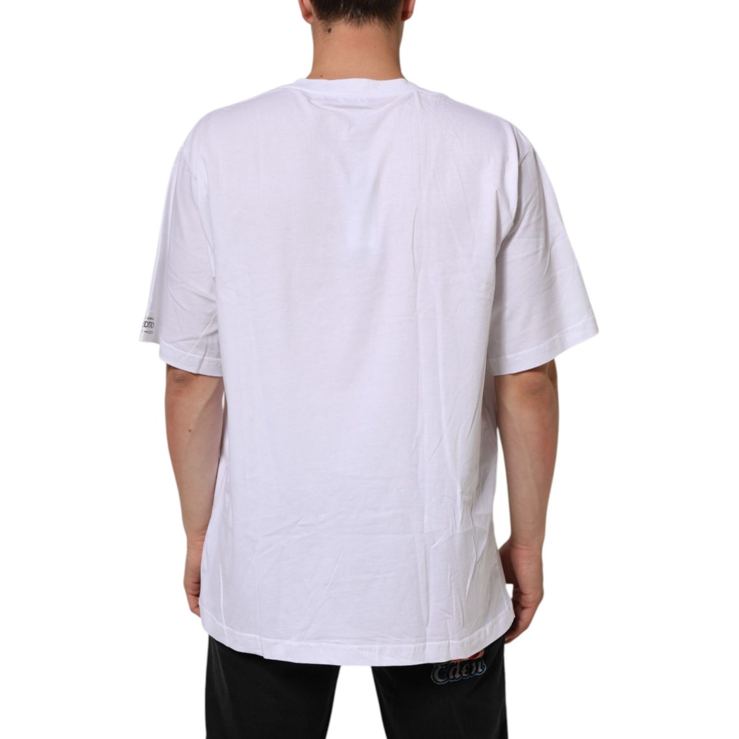 Back view of Dolce & Gabbana White Graphic Print Cotton CrewNeck T-shirt, model wearing plain white back design, short sleeves, crew neckline.