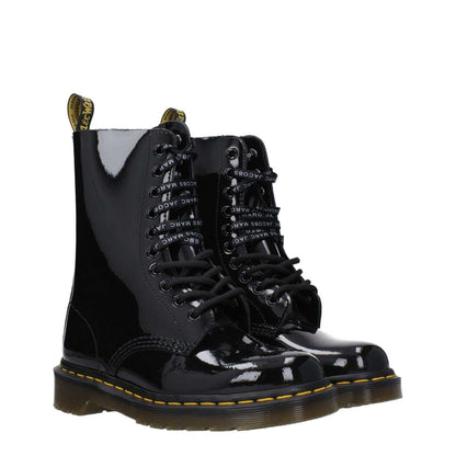 Dr. Martens Black Leather Ankle Boots in patent leather with lace-up closure and rubber sole, casual style with round toe and low, flat heel.