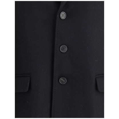 Close-up of Dsquared² Black Wool Coat with button closure and side pockets, showcasing elegant and structured felted wool.