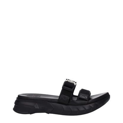 Givenchy Black Fabric Slippers with silver logo, open toe, mid heels, and rubber sole, featuring clips closure. MPN: BH301QH1A2001.