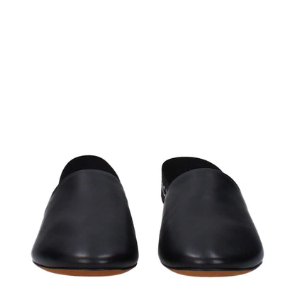 Givenchy Black Leather Mules with round toe and low flat heel, featuring side and back logo, made entirely of leather, casual style.