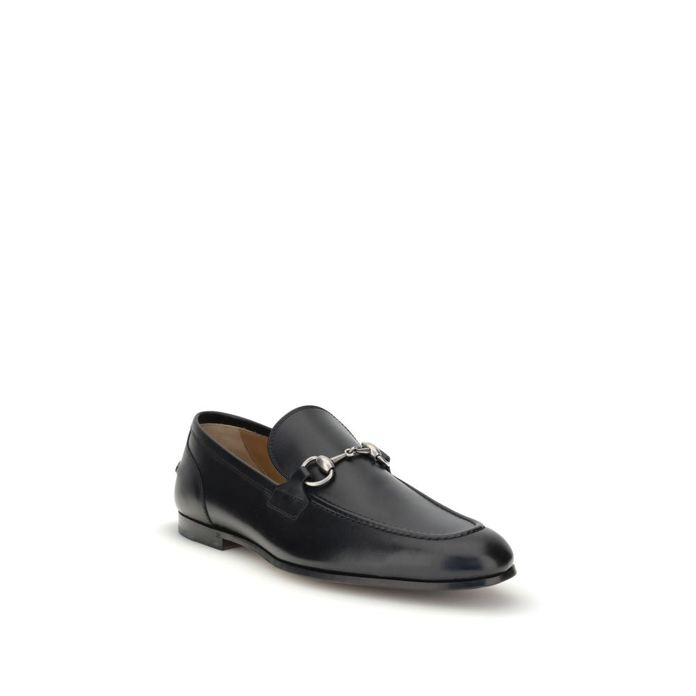Gucci Black Calf Leather Bos Taurus Slip-On Loafers with metallic Morsetto detail for formal and casual looks.
