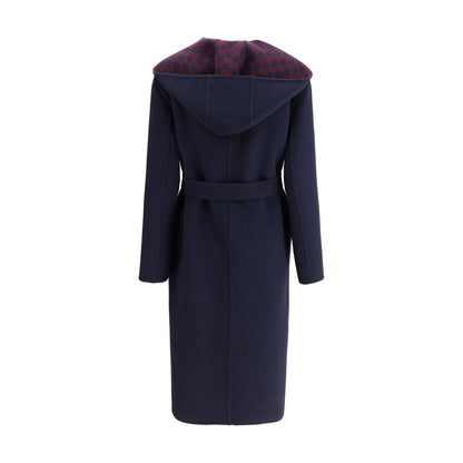 Back view of Gucci Blue Wool Coat with hood and sash, showcasing iconic Gucci monogram lining, elegant and functional design.