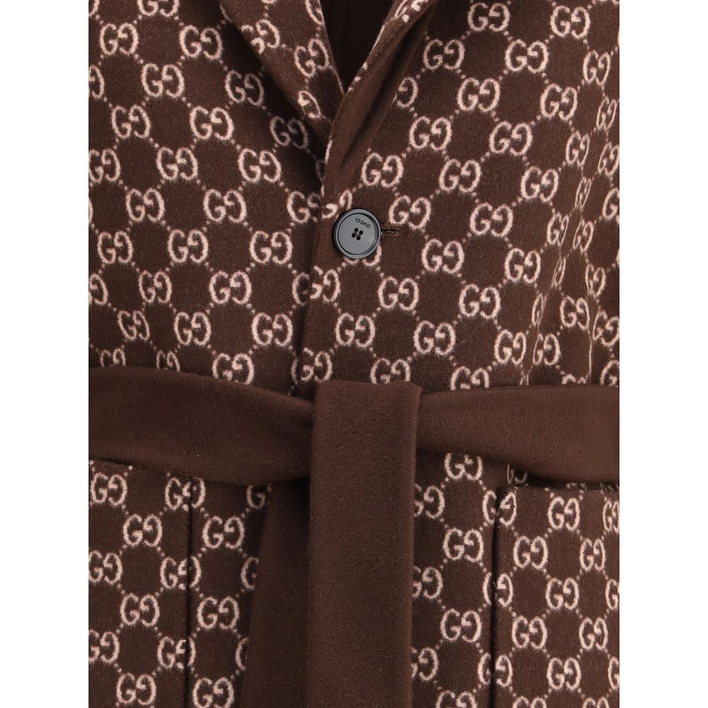 Close-up of Gucci Brown Wool Coat with GG pattern and button closure showcasing luxury fashion details.