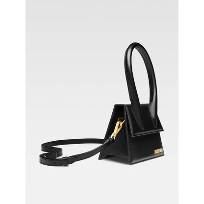 Jacquemus Le Chiquito Moyen Black Bag with gold hardware, removable strap, and magnetic flap closure. Elegant and stylish luxury accessory.