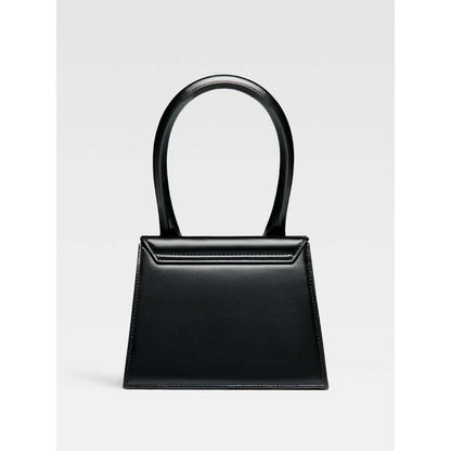 Jacquemus Le Chiquito Moyen Black Bag with gold hardware, magnetic flap closure, and removable shoulder strap, 18 x 13.5 cm.