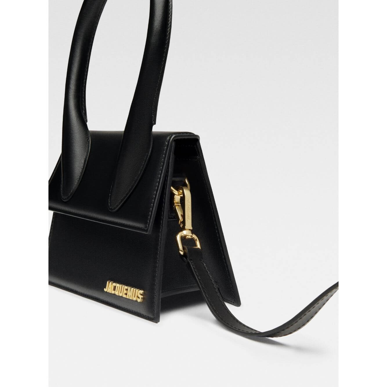 Jacquemus Le Chiquito Moyen Black Bag with gold hardware, featuring a removable strap and magnetic flap closure.