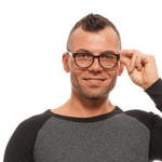Model wearing Longines Brown Unisex Glasses Frame, round shape, full-rim, plastic material, showcasing stylish eyewear fashion.