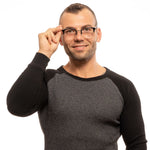 Man wearing Lozza Black Unisex Glasses Frame, half-rim style with trapezium lenses. Branded case included, no spring hinge.