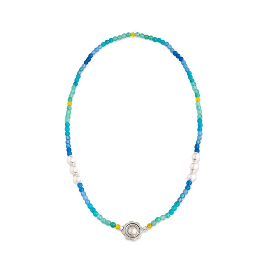 Colorful beaded necklace featuring a central silver design and pearls. Bright and stylish accessory.
