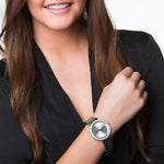 Woman wearing MICHAEL KORS WATCHES Mod. MK3190 with black outfit showcasing watch on wrist.