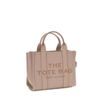 Marc Jacobs The Small Tote Handbag in beige grained leather with tubular handles and zippered closure.