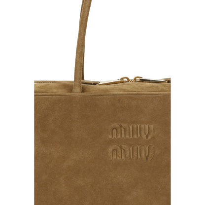 Miu Miu Beige Calf Leather Bos Taurus Handbag with suede design, featuring top handle, zipper closure, and embossed brand logo.