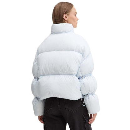 Moose Knuckles Light Blue Nylon Women Jacket with down padding and drawstring details, perfect for stylish warmth and comfort.