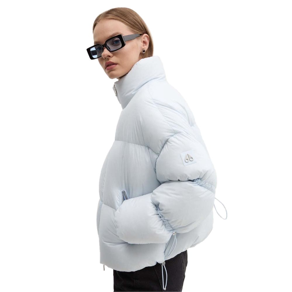 Moose Knuckles Light Blue Nylon Women Jacket featuring down padding and drawstring details, ideal for style and warmth in cool weather.