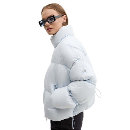 Moose Knuckles Light Blue Nylon Women Jacket featuring down padding and drawstring details, ideal for style and warmth in cool weather.