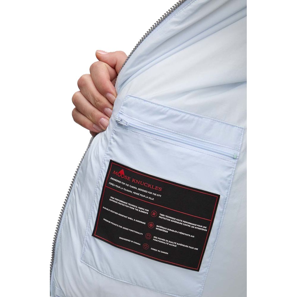 Interior label of Moose Knuckles Light Blue Nylon Women Jacket showing design and brand details.