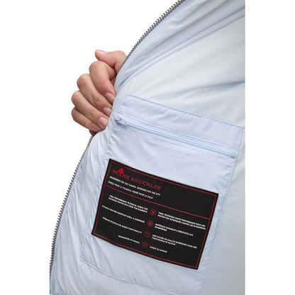 Interior label of Moose Knuckles Light Blue Nylon Women Jacket showing design and brand details.