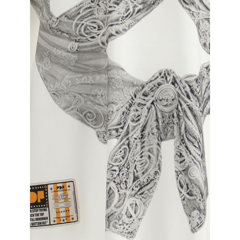 Detailed embossed design on PDF Channel Cream Cotton T-Shirt showcasing the Boy White Flake pattern with unique style.