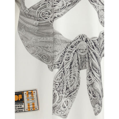 Detailed embossed design on PDF Channel Cream Cotton T-Shirt showcasing the Boy White Flake pattern with unique style.