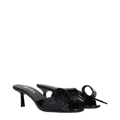 Prada Black Leather Sandals with mid heels, open toe, and front detail. Casual style perfect for elegant everyday wear.