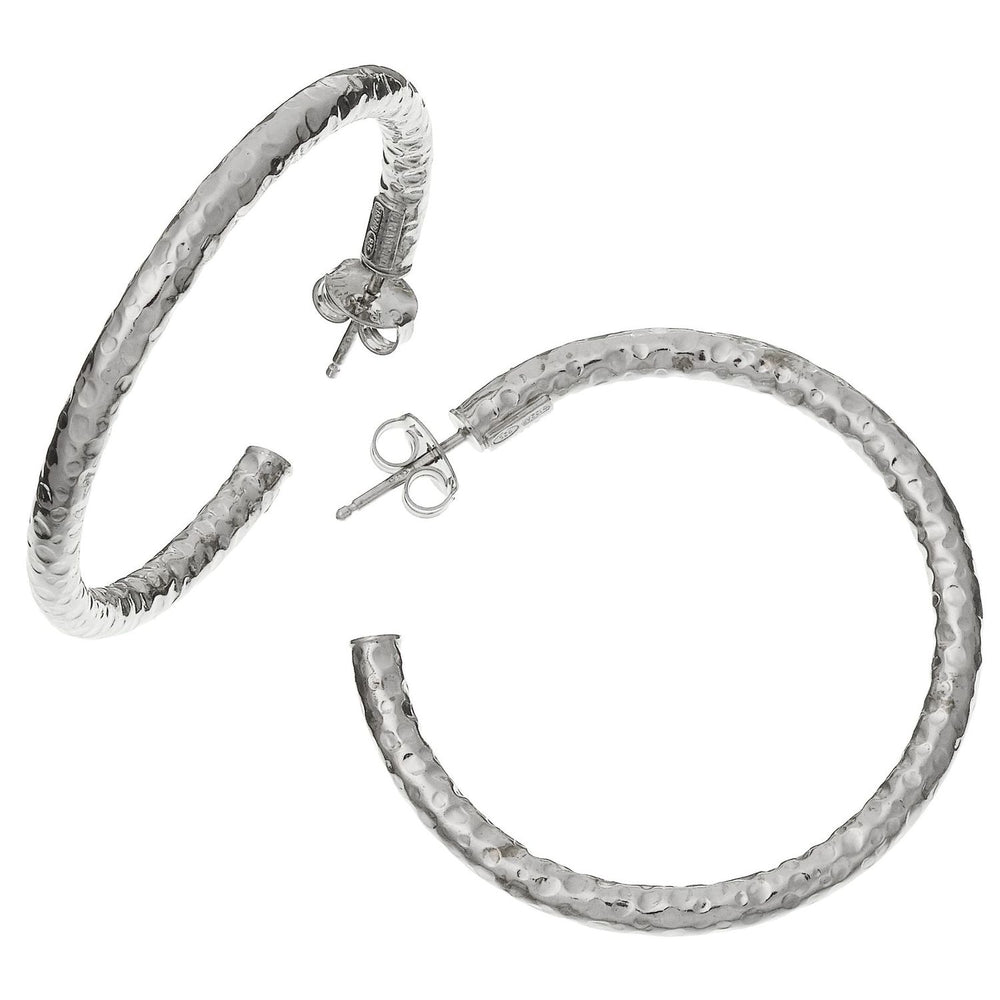 Elegant hoop earrings with a hammered texture in sterling silver, displayed on a white background.