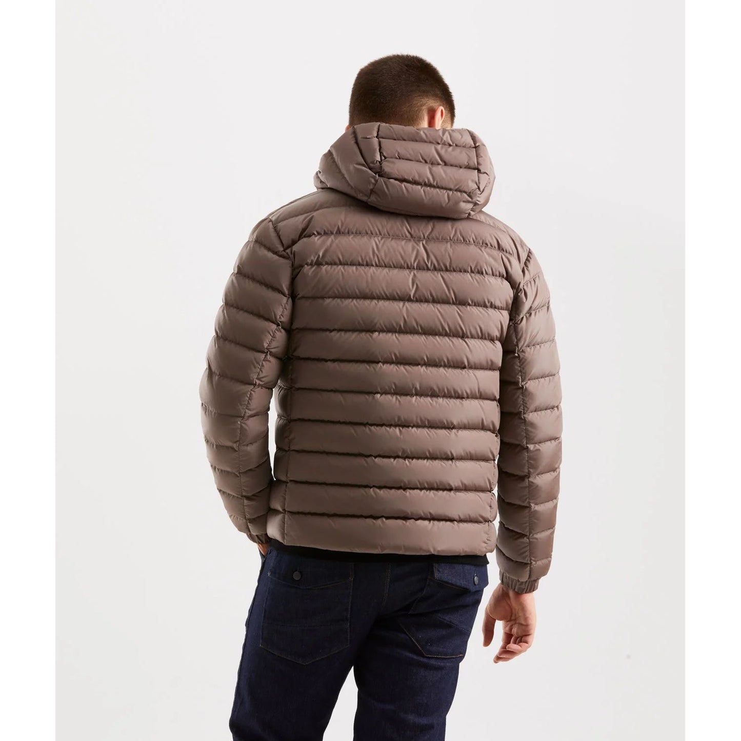 Man wearing Refrigiwear Beige Nylon Men Jacket with hood, showing back view, ideal for urban style and warmth.