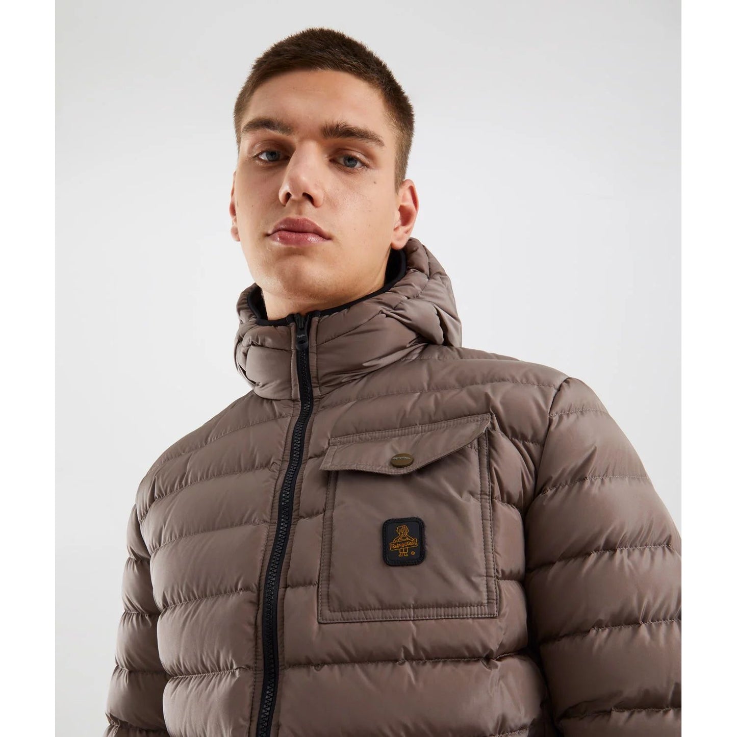 Refrigiwear Beige Nylon Men Jacket with hood and buttoned chest pocket, offering urban style and warmth for city adventures.