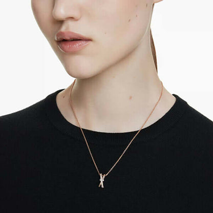 SWAROVSKI Mod. 5689788 Hyperbola Pendant Necklace worn by model, rose gold-tone plated with Swarovski Zirconia.