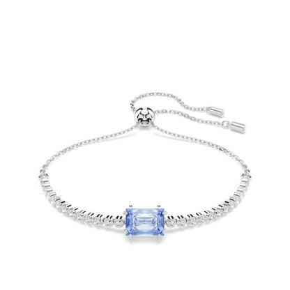 Elegant bracelet with blue gemstone centerpiece and adjustable chain, representing luxury jewelry design.