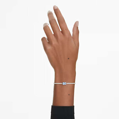 Elegant lady's hand wearing a delicate Swarovski bracelet, showcasing the jewelry's design and fit.