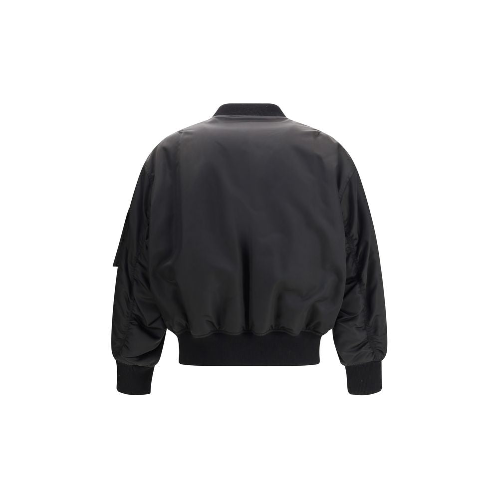Rear view of Saint Laurent Black Polyamide Bomber jacket with ribbed trim and baseball collar, showcasing oversize fit and sleek design.