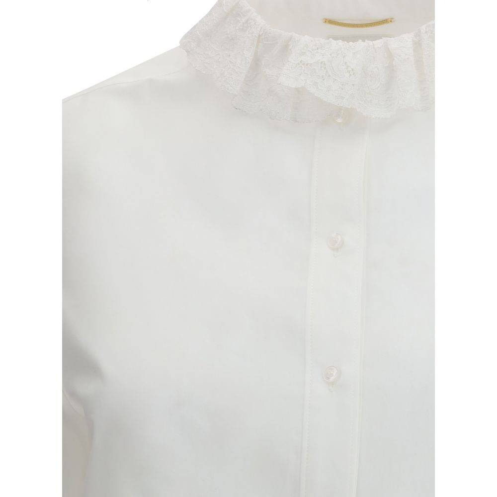 Saint Laurent White Cotton Dress Shirt with lace-trimmed Pierrot collar, showcasing buttons and beveled cuffs for refined elegance.