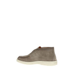 Santoni Desert Ankle Boots in soft suede with tray stitching and rubber sole, showcasing a blend of craftsmanship and contemporary style.