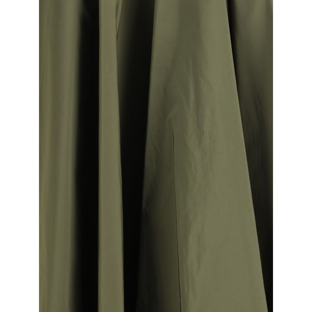 Sara Roka Green Polyester Midi Skirt with flowing design and side zipper, featuring two front welt pockets for added style and function.
