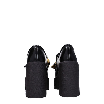 Back view of Stella McCartney Black Leather Platform Loafers with high heel and eco leather design featuring a vintage effect.