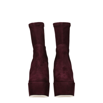 Stuart Weitzman Purple Leather Ankle Boots with high heel, round toe, and suede finish, shown from the back view.