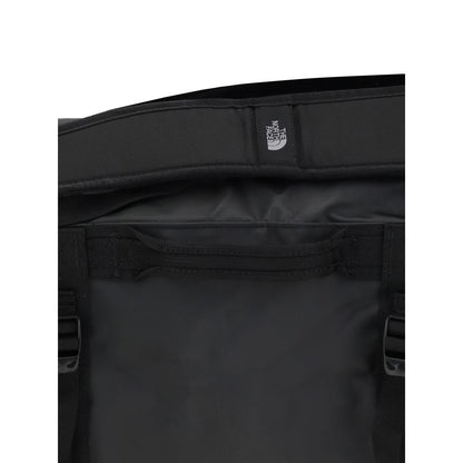 The North Face Black Nylon Luggage And Travel featuring durable waterproof material and padded handles.