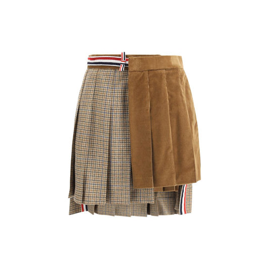 Thom Browne Brown Wool Mini Skirt with pleated velvet and houndstooth layers, iconic striped side band, and adjustable button closure.