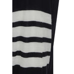 Close-up of Thom Browne Cardigan featuring striped black and white cuffs, fleece wool fabric, part of the iconic design.