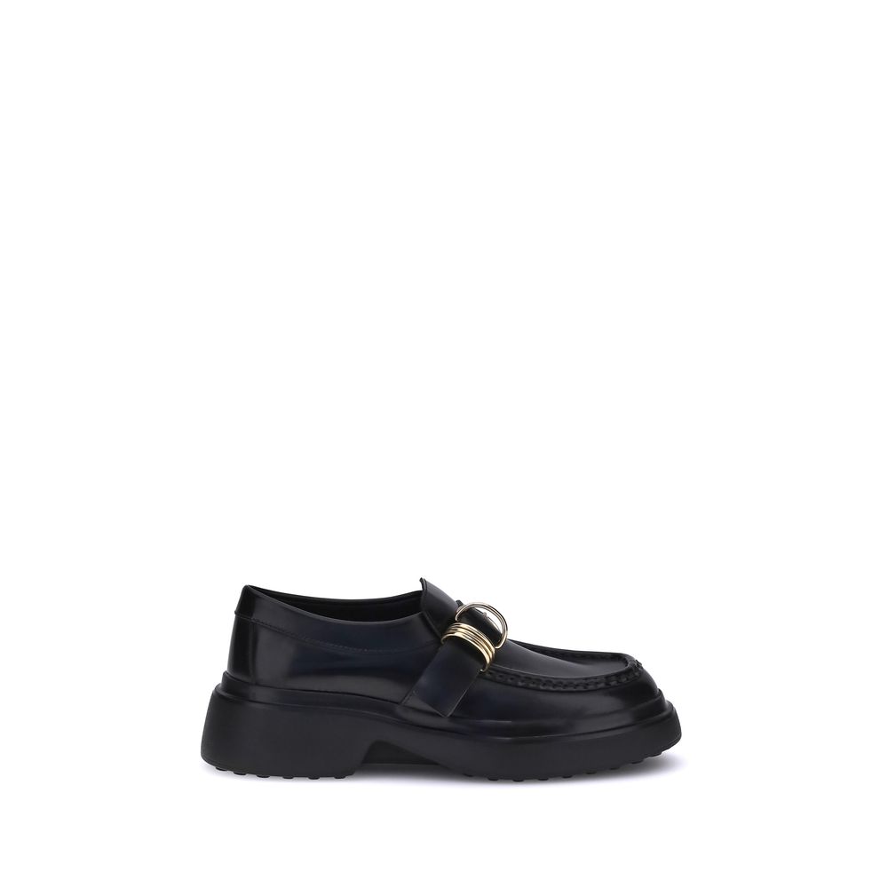 Tod's Black Rubber Platform Loafers with metal rings and nappa leather, showcasing contemporary and timeless style.