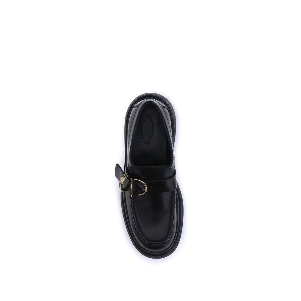 Top view of Tod's Black Rubber Platform Loafers with metal ring embellishment on soft nappa leather, featuring a contemporary design.