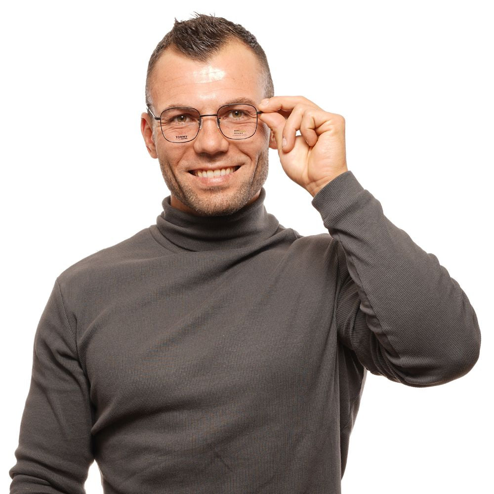 Man wearing Tommy Hilfiger Black Unisex Glasses Frame with a smile, showcasing full-rim square design and black color.