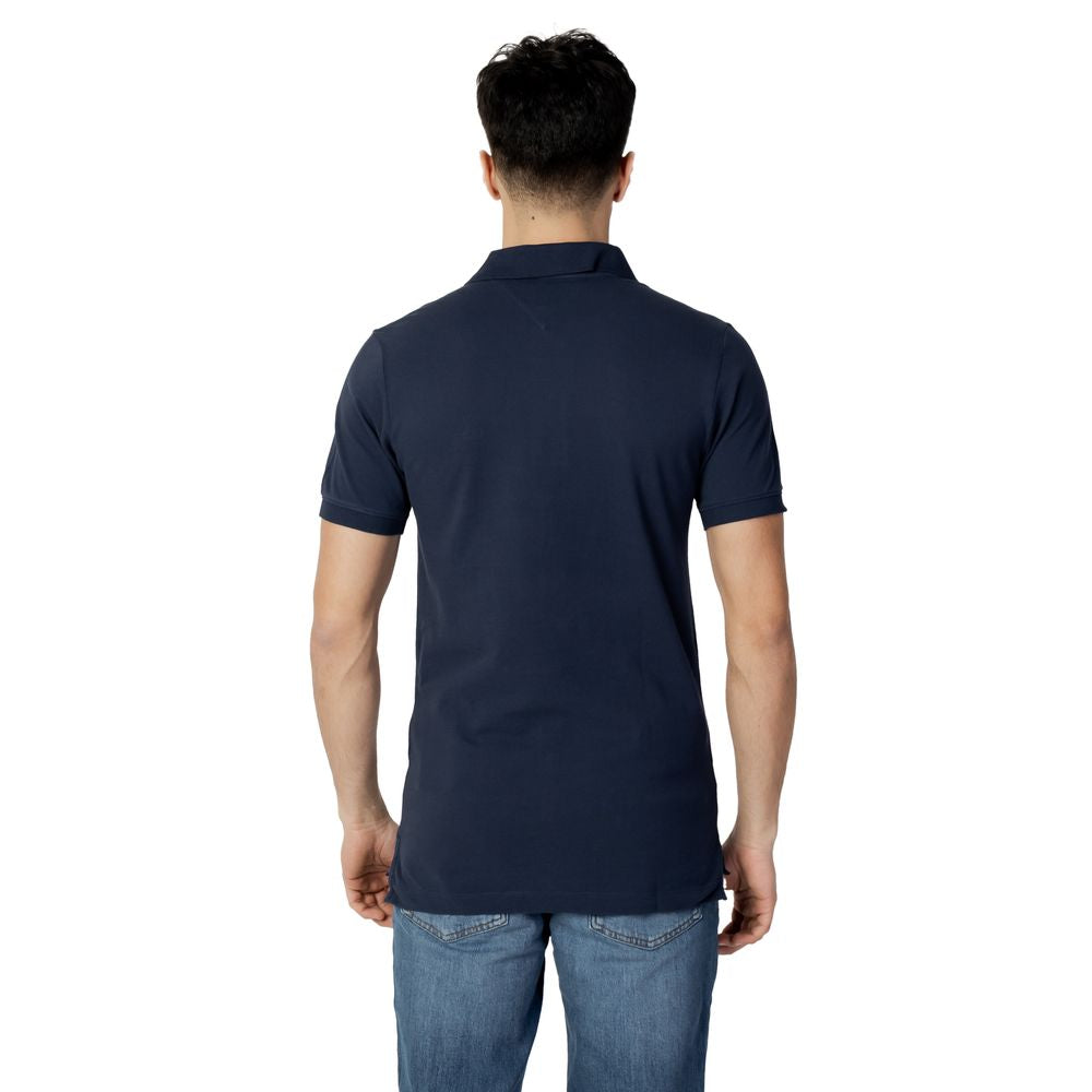 Back view of a model wearing a Tommy Hilfiger Jeans Blue Cotton Polo Shirt, showcasing the slim-fit design and short sleeves.