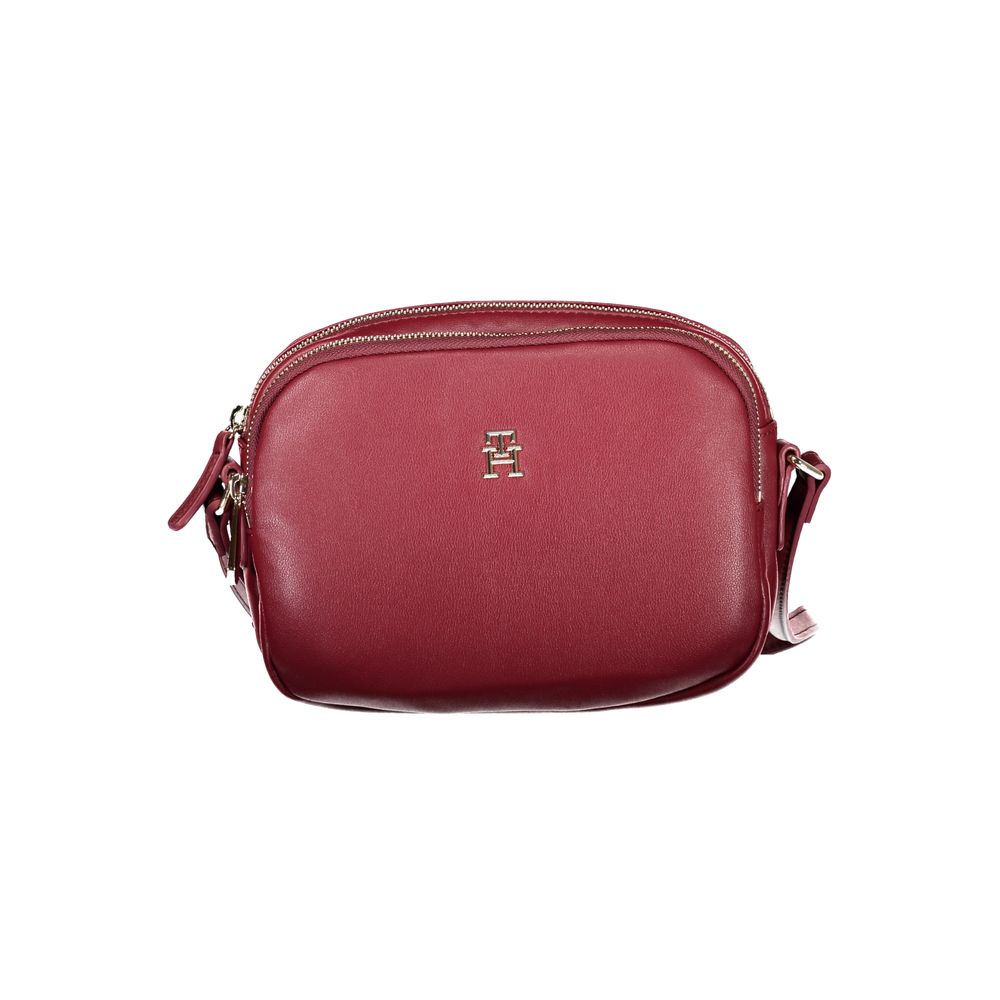 Tommy Hilfiger Red Polyester Handbag with adjustable shoulder strap, two compartments, internal pocket, and zip closure.