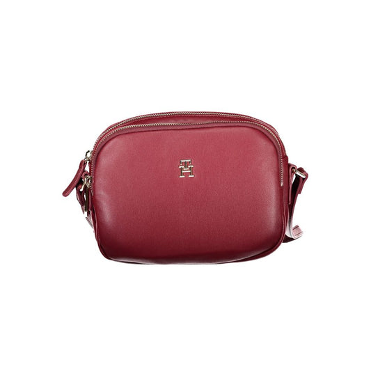 Tommy Hilfiger Red Polyester Handbag with adjustable shoulder strap, two compartments, internal pocket, and zip closure.