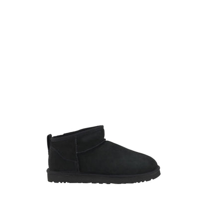 UGG Black Goatskin Ankle Boots with shearling lining and knurled sole for grip, featuring iconic monogram and suede design.
