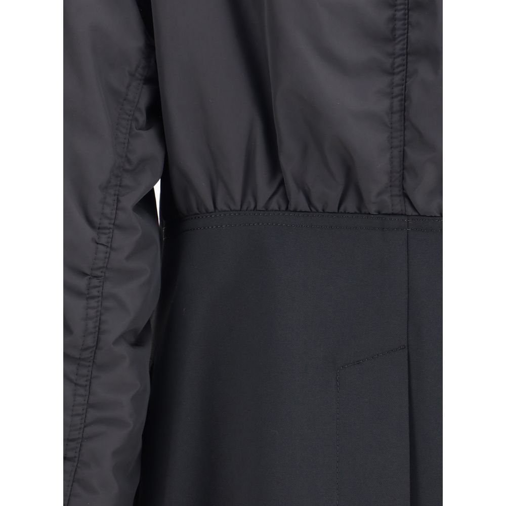 Close-up of Undercover Black Polyester Bomber featuring hybrid design with bomber jacket and blazer elements.