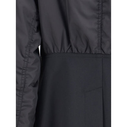 Close-up of Undercover Black Polyester Bomber featuring hybrid design with bomber jacket and blazer elements.