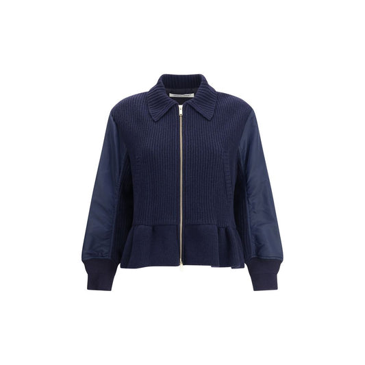 Undercover Blue Wool Bomber with classic collar, ribbed cuffs, flared hem, and wool inserts showcasing modern streetwear style.